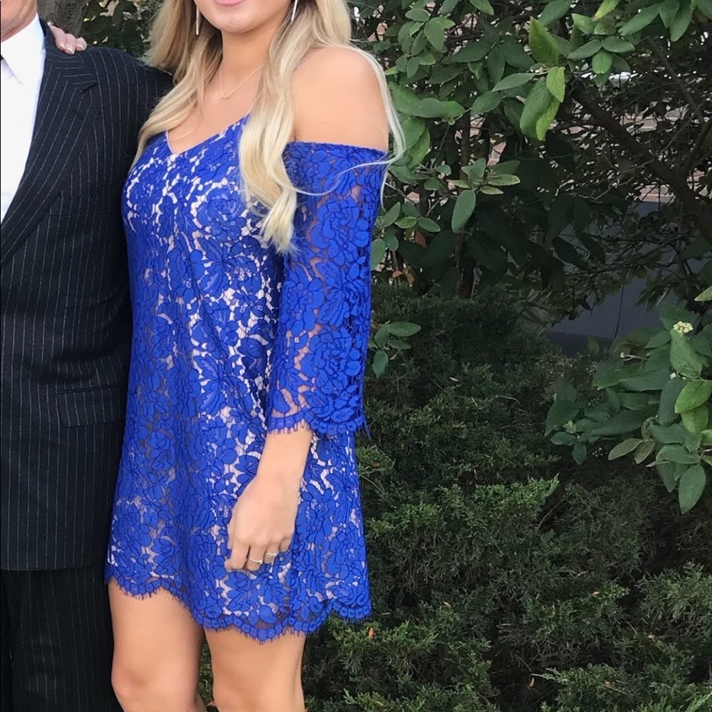 Blue off the shoulder dress.